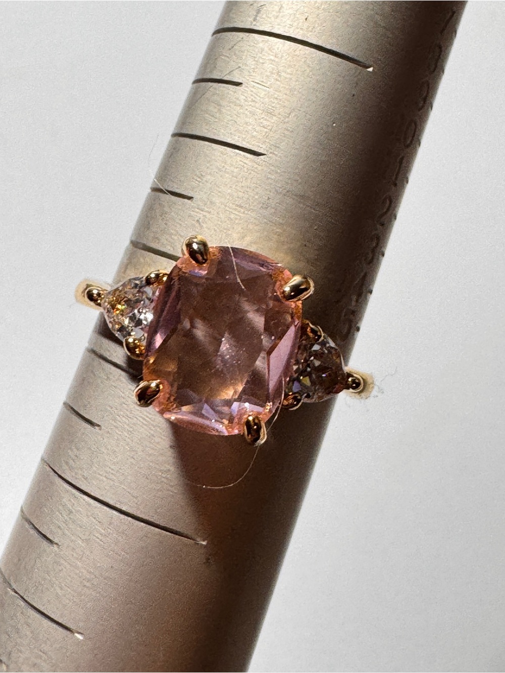 Gold Tone Ring with Pink Cushion-Cut Center Stone and Side Accents